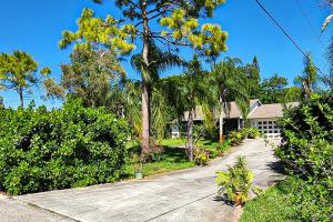 a house with a driveway in front of a house at Sundial Sanctuary in Fort Myers