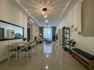 a living room with a table and a dining room at Affordable Family Stay in Bangi in Kajang