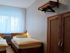 Ένα ή περισσότερα κρεβάτια σε δωμάτιο στο Abendsonne Apartments