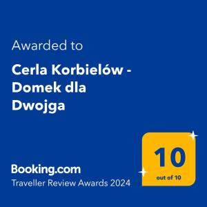 Ett certifikat, pris eller annat dokument som visas upp på Cerla Korbielów - Domek dla Dwojga