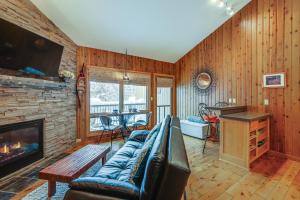 a living room with a couch and a fireplace at Mt Bachelor Village Resort Condo 19 Mi to Skiing! in Bend