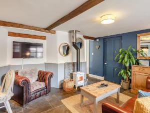 a living room with a couch and a table at 1 bed in Wedmore 51341 in Chapel Allerton