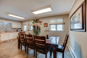 a kitchen and dining room with a table and chairs at Rector Home with Hot Tub about 6 Mi to Ligonier! in Rector