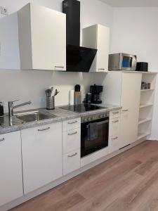 Kuchyň nebo kuchyňský kout v ubytování Monteurwohnung Burchard I Rosenau - Platz für 6 Personen