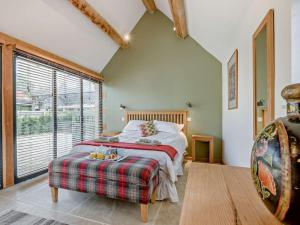 a bedroom with a bed and a large window at 1 bed property in Lechlade 31912 in Lechlade