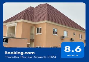 a house with a roof on top of it at C7 Hazelwood Residence & Suites in Abuja