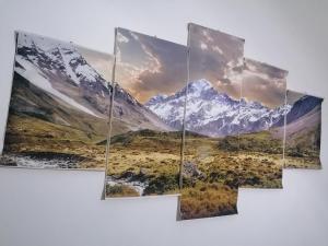 a group of snow capped mountains and a valley in the foreground at Melissa lux in Ciampino