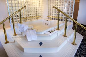 a bathroom with a bath tub in a room at The Claridge Hotel in Atlantic City