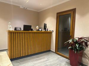 TV a/nebo společenská místnost v ubytování Hotel Gjika