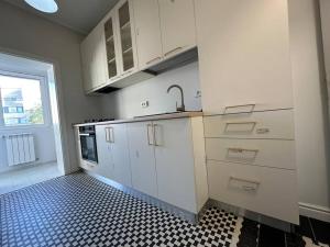Kuchyň nebo kuchyňský kout v ubytování Cozy Apartment - 30 sqm terrace + 5 fotografií