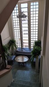 a living room with a couch and a table at Hotel Abrego in San Salvador