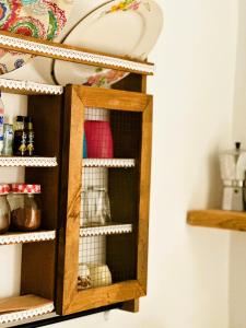 a shelf in a kitchen with a cupboard at Errika's Sweet Home in Provatas