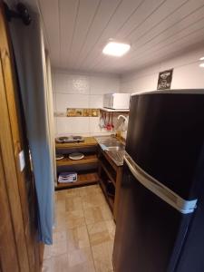 Una cocina o cocineta en Trip Adventure Hostel
