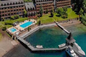 an aerial view of a large swimming pool in the water at Bahia Manzano Resort in Villa La Angostura