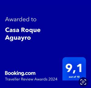 a blue screen with the text awarded to casa rogue aquarius at Casa Roque Aguayro in Agüimes