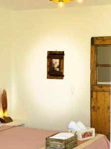 a room with a bed and a wooden door at Errika's Sweet Home in Provatas