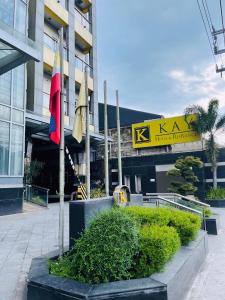 a building with two flags in front of it at Deluxe Room in Angeles