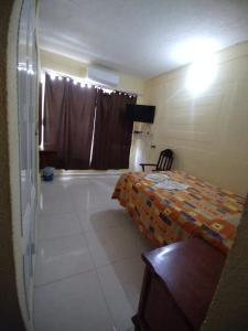 Katil atau katil-katil dalam bilik di Hotel Puerto Real-Minatitlán