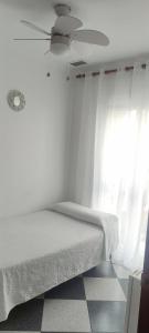 Postel nebo postele na pokoji v ubytování Hostal Restaurante La Giralda