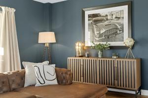 a living room with a couch and a picture of a car at Luxury Stay at Oakmere Lodge in Oxton