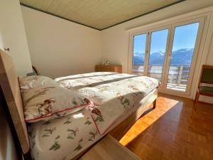 Ліжко або ліжка в номері Chalet La Louise avec vue imprenable