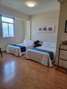 Voodi või voodid majutusasutuse HOTEL TRUEBA toas