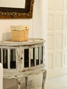 a wicker basket on a table next to a door at Errika's Sweet Home in Provatas