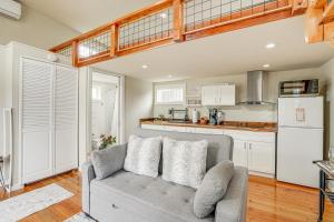 a living room with a couch and a kitchen at Pacheco Studio Cottage, 22 Mi to Downtown Oakland 