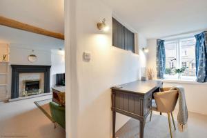 a home office with a desk and a chair at Stonemason's Cottage in South Cerney