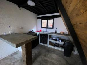 a kitchen with a large counter top in a room at Vive Libre Travel Club in Santiago
