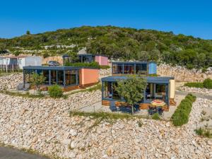 an aerial view of a house on a beach at Kasthouse Luxury mobile home Orange in Mali Lošinj