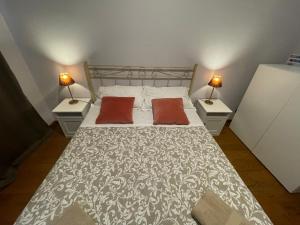 Postel nebo postele na pokoji v ubytování Paradise Rooms - Brignole Station