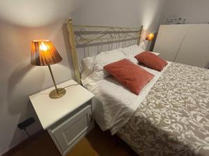 Postel nebo postele na pokoji v ubytování Paradise Rooms - Brignole Station