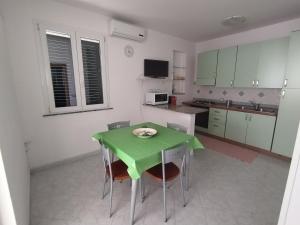 Kuchyň nebo kuchyňský kout v ubytování Appartamenti Venticello + 21 fotografií