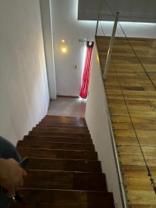 a staircase in a building with a red curtain at ITALIA 1 in Villa María