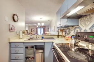 a kitchen with a sink and a stove at Beaufort Home with Patio 3 Mi to Downtown! in Beaufort