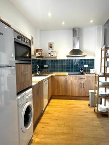 a kitchen with a washer and a dishwasher at Regimiento 2, center, new, quite, breakfast included, parking on request, RG in Málaga
