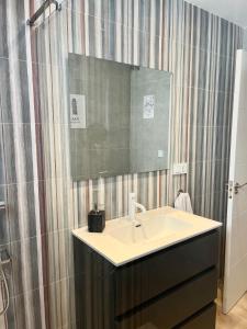 a bathroom with a sink and a mirror at Regimiento 2, center, new, quite, breakfast included, parking on request, RG in Málaga