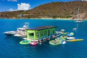 a group of people on inflatable tubes in the water at Mandavilla Rose - Inspired USVI - Generator - Starlink in Cruz Bay