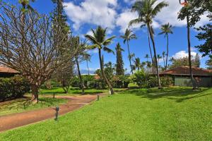 a park with palm trees and a road at International Colony Club 37 in Kaanapali