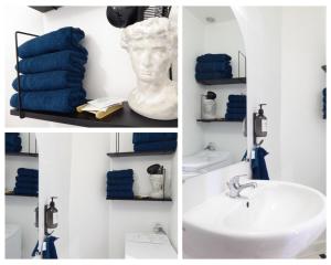 een badkamer met een wastafel en blauwe handdoeken bij Private house in the center near the Castle in Tournon-sur-Rhône