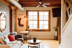 a living room with a couch and a table at Broken Clock in Springfield