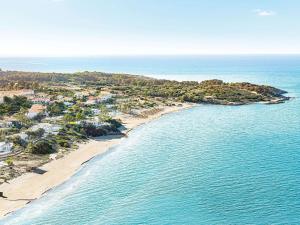 an aerial view of a beach and the ocean at Grecotel Olympia Oasis & Aqua Park in Loutra Killinis