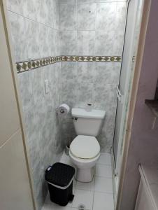 a small bathroom with a toilet and a shower at comodidad y ubicación. in Medellín