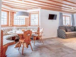 a living room with a table and a couch at Selbhorn in Hinterthal