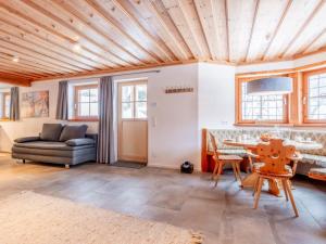 a living room with a wooden ceiling at Selbhorn in Hinterthal