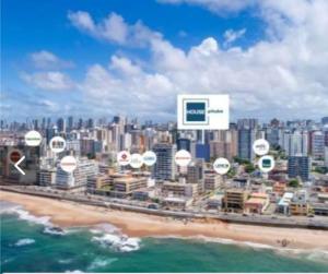 a view of a city with a beach and buildings at Apto 400 mt da orla in Salvador