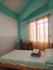 Postel nebo postele na pokoji v ubytování Pas-it Hostel Sagada