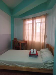 Postel nebo postele na pokoji v ubytování Pas-it Hostel Sagada