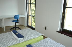 Postel nebo postele na pokoji v ubytování Residence Meljska